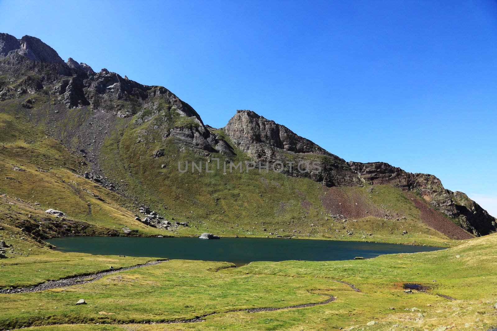 Image of the lake d'Anglas (2068m) located in the Atlantique-Pyrenees mountains above the famous sky station Gourette in south of France.