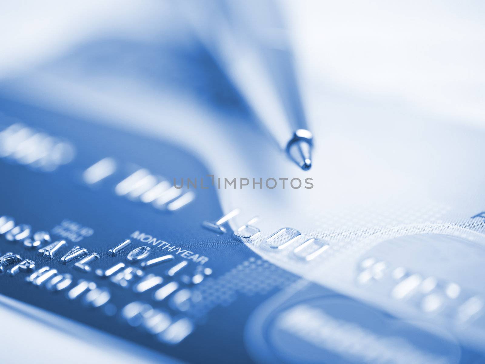 Close up a credit card and pen