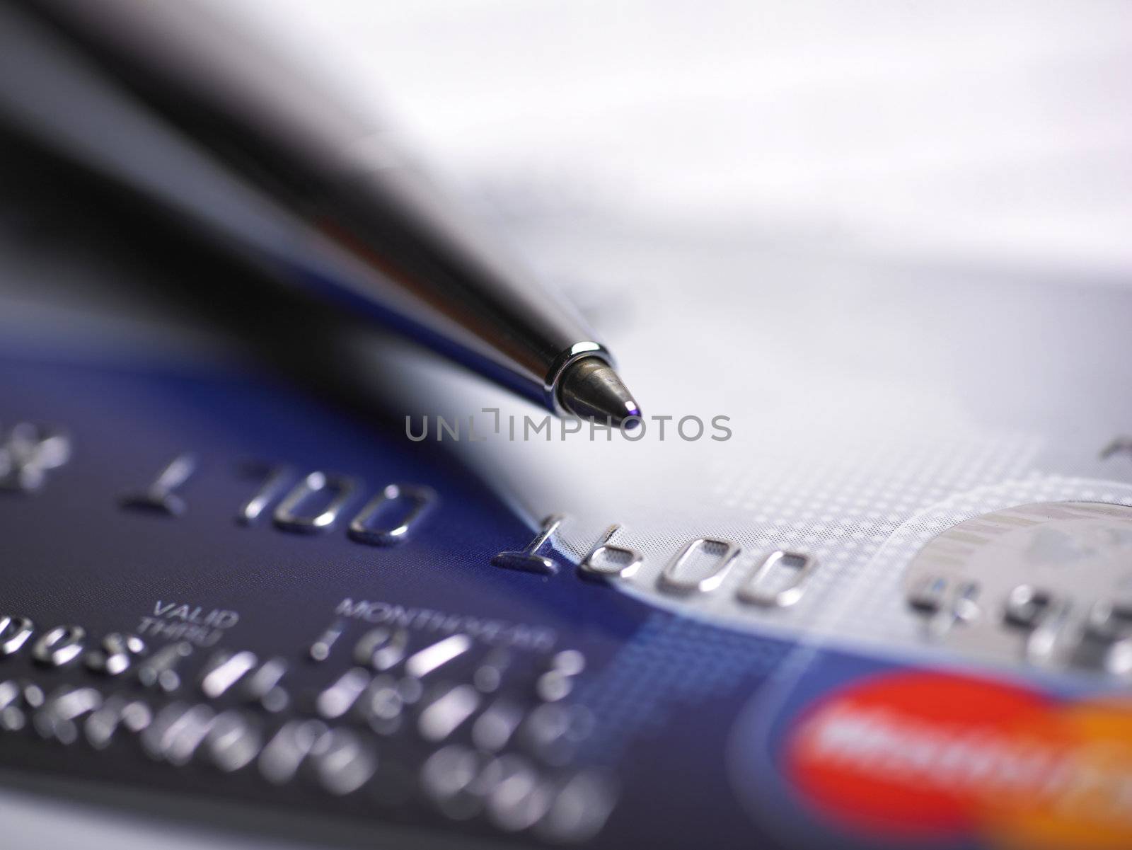 Close up a credit card and pen