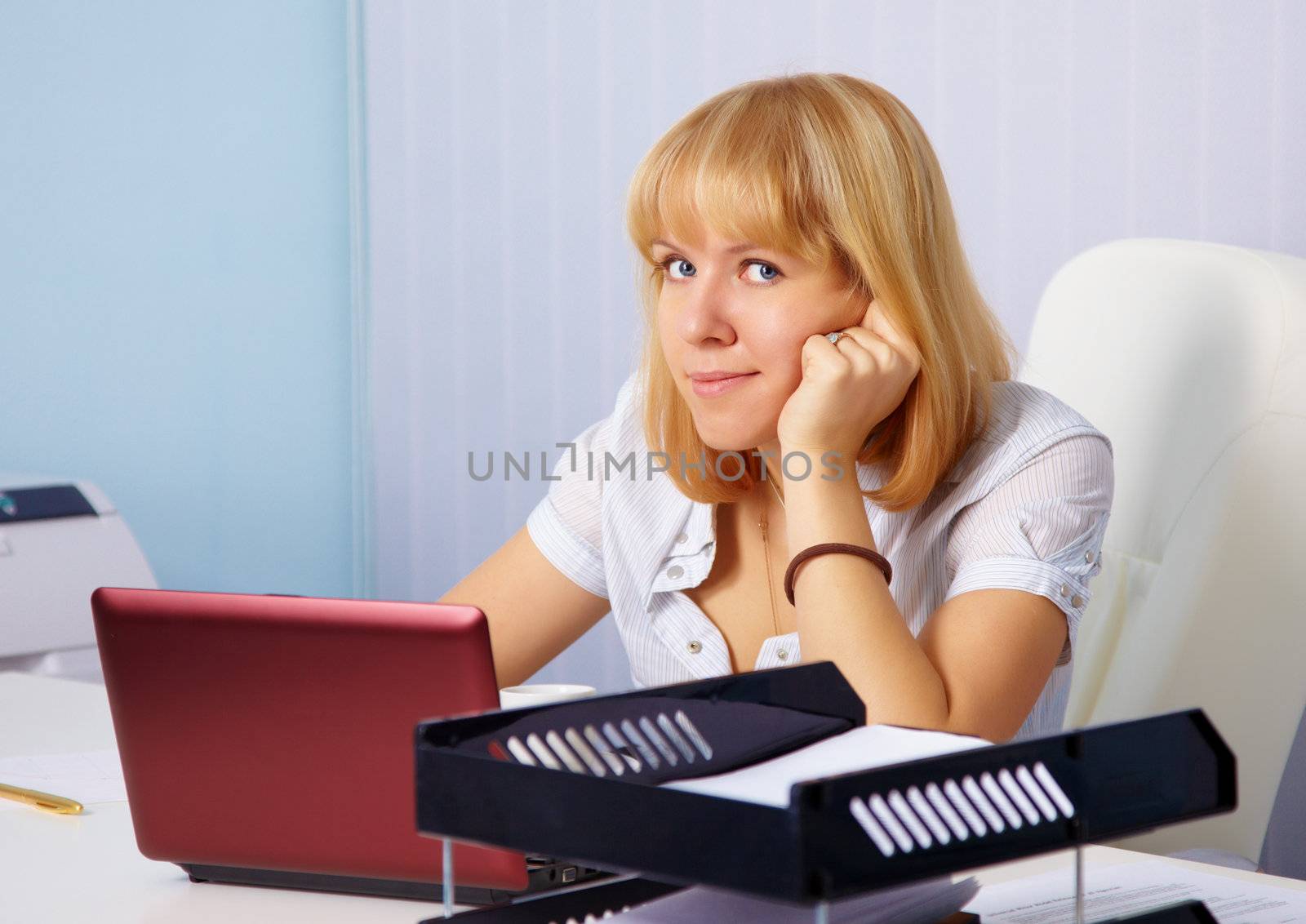 Woman at workplace in office by pzaxe