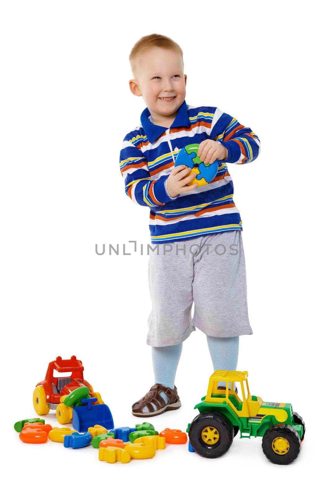 A child playing with plastic toys isolated on white background