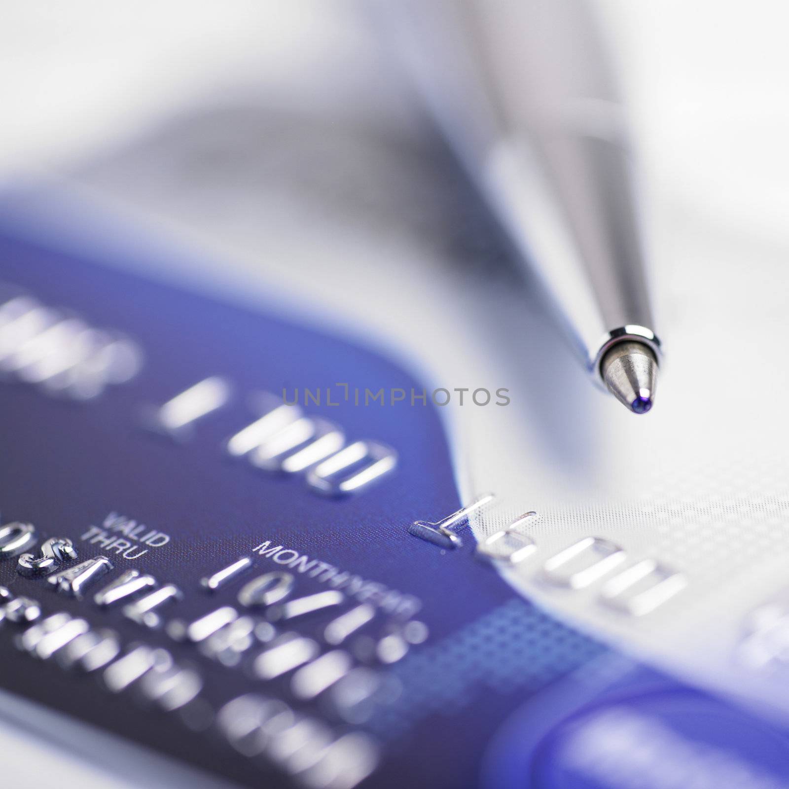 Close up a credit card and pen
