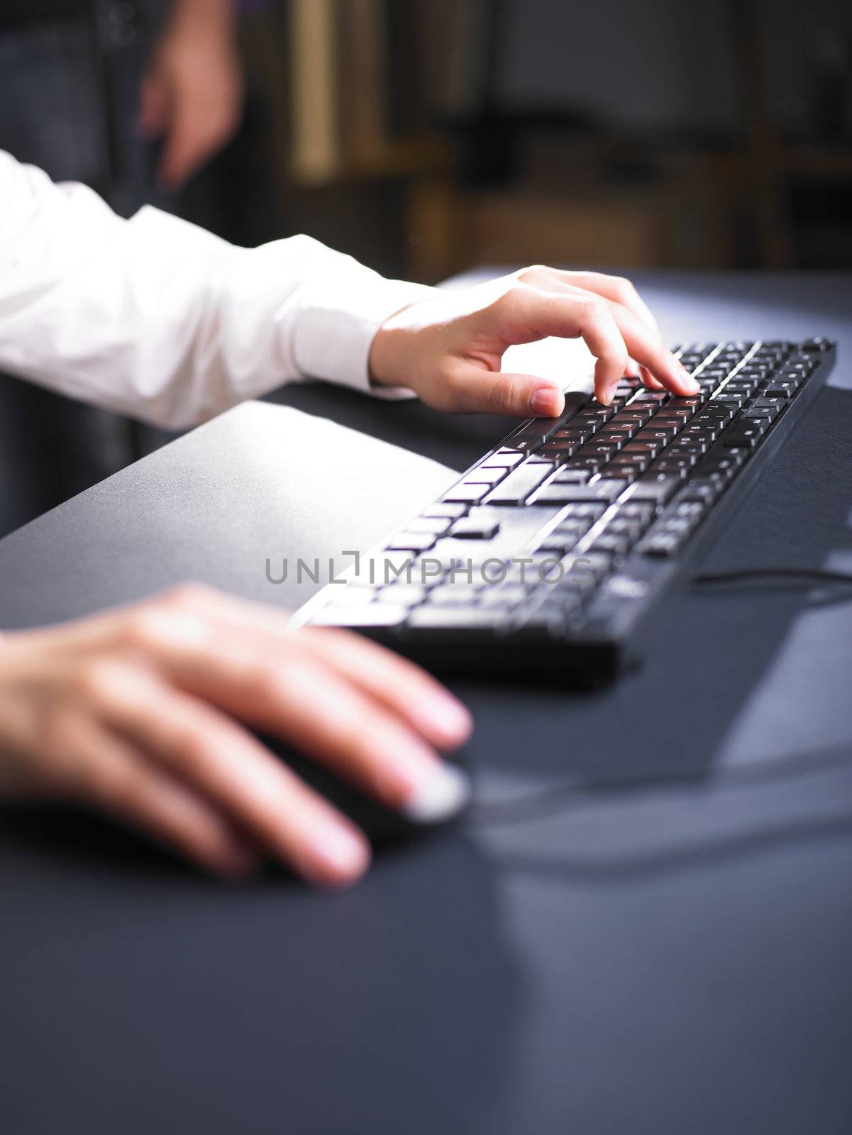 Business Woman Typing on Computer Keyboard by adamr