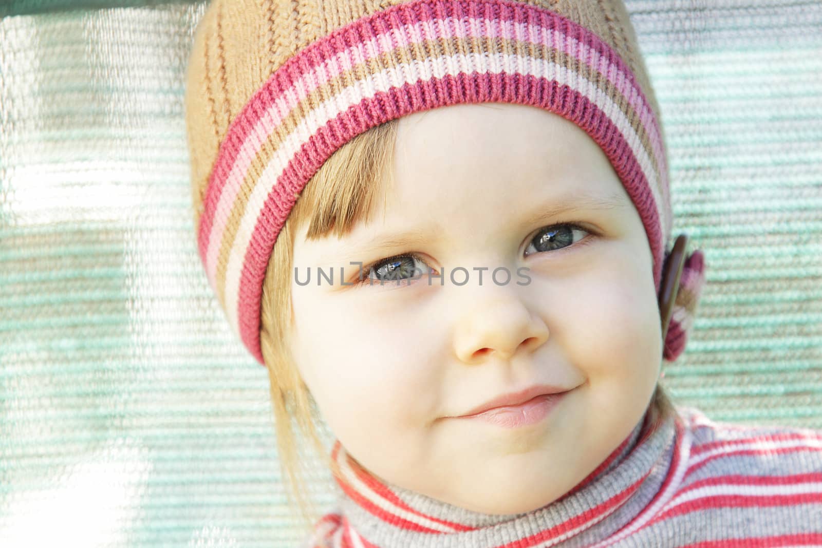 Cute little girl with knit hat outdoors