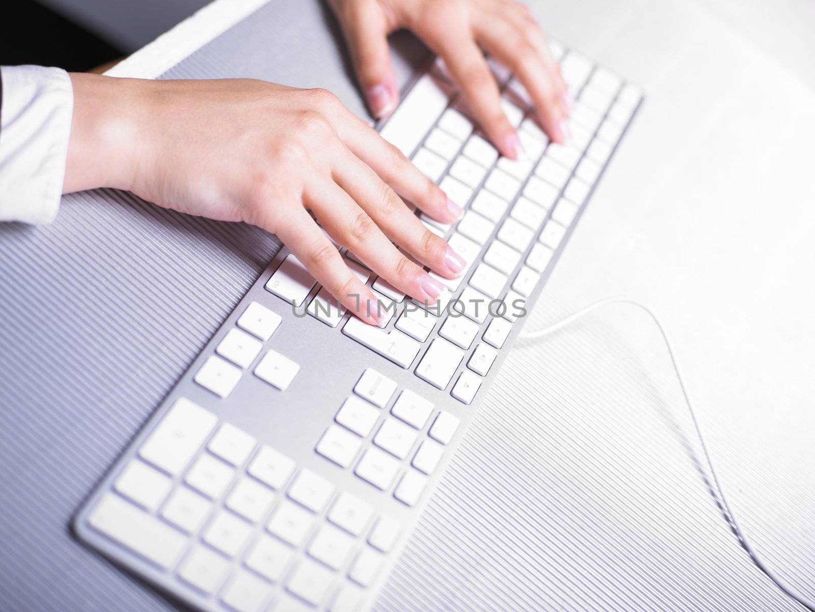 Business Secretary Typing on Computer Keyboard