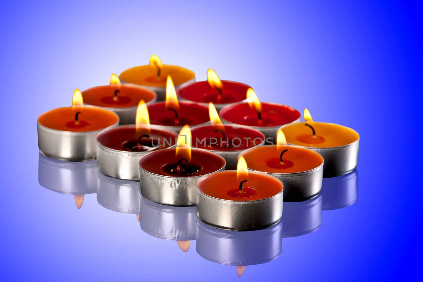 colored candles on blue background