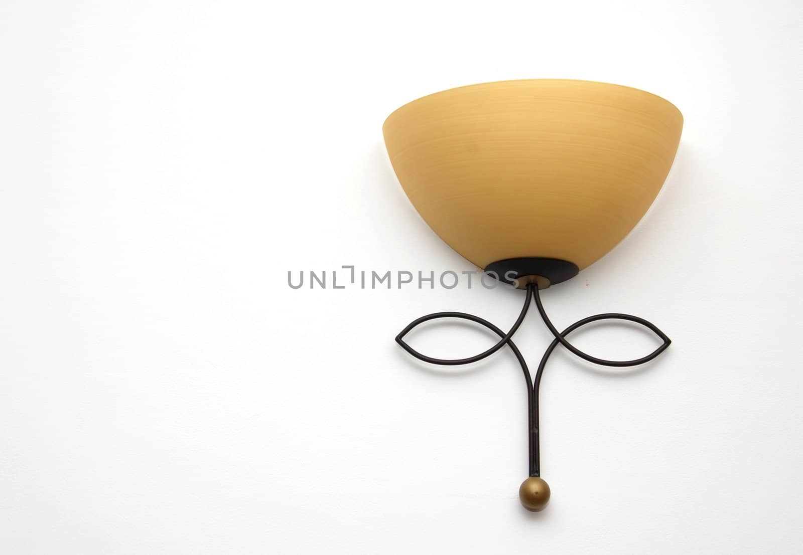 one yellow rustic lamp on white wall