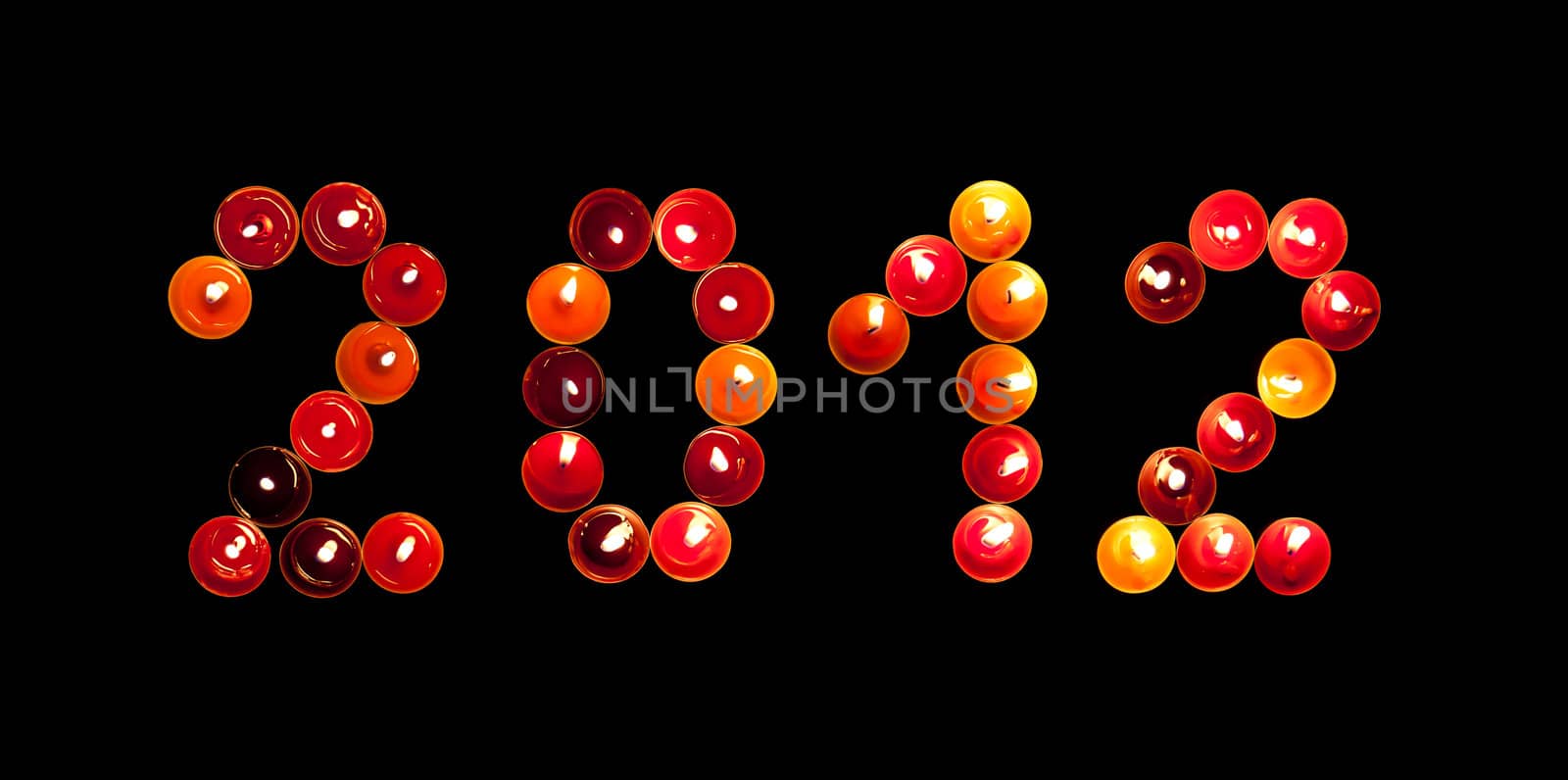 2012 made ​​of colored candles on a black background
