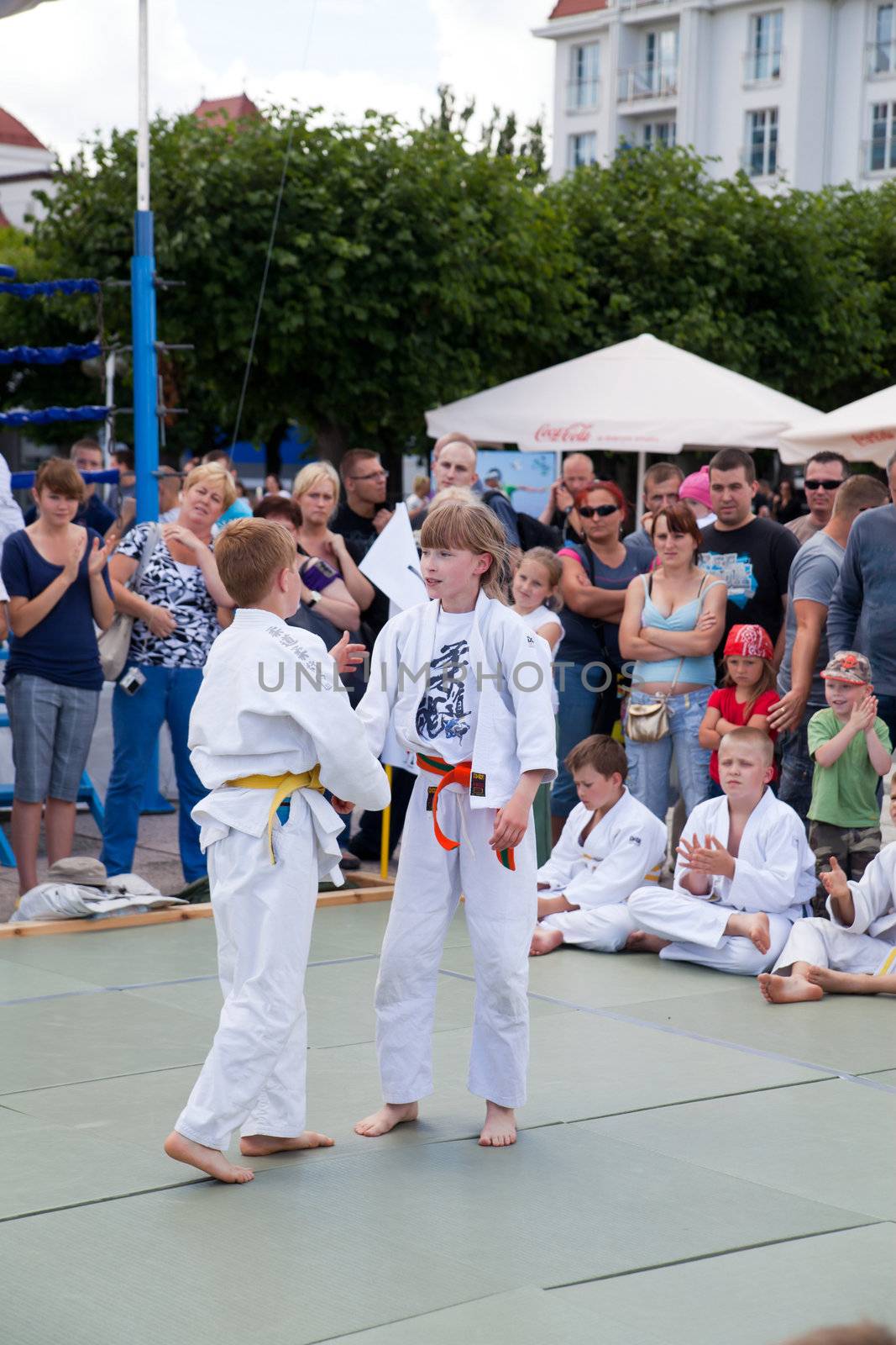 SOPOT, POLAND - JULY 16: The karate kids fighting for the competition on July 16, 2011 in Sopot, Poland by remik44992