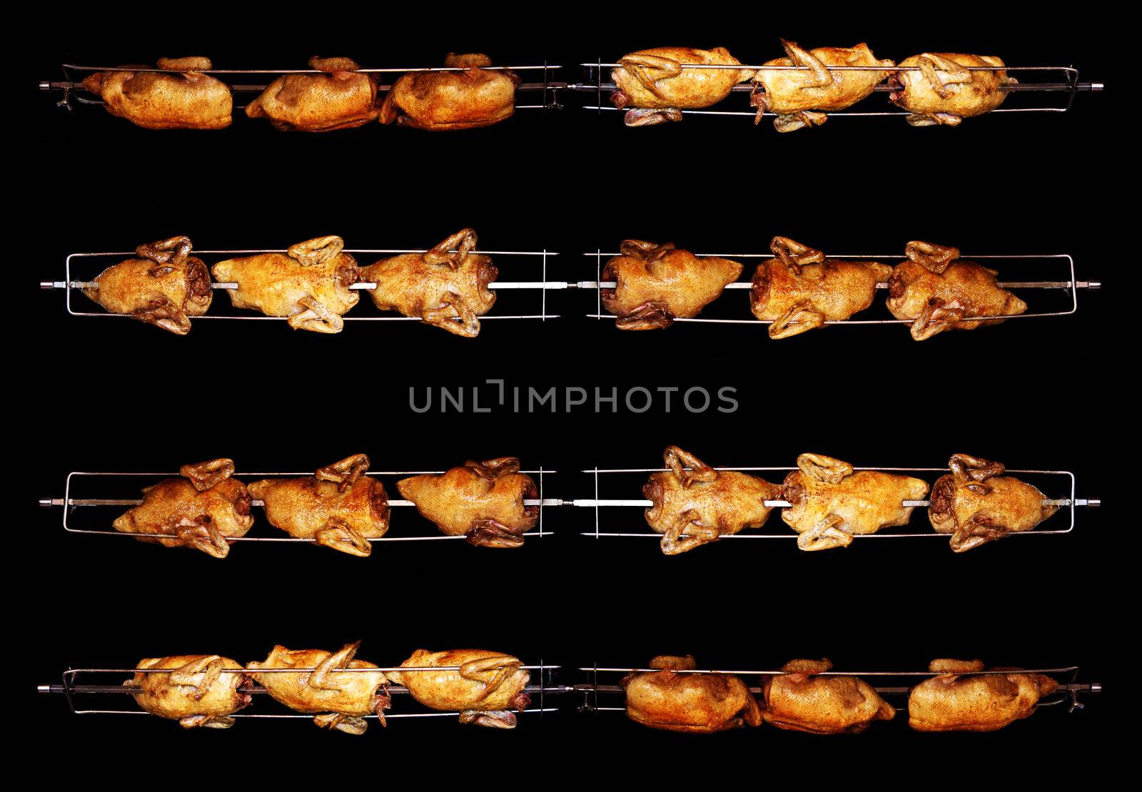 Grill chicken on a skewer by photochecker