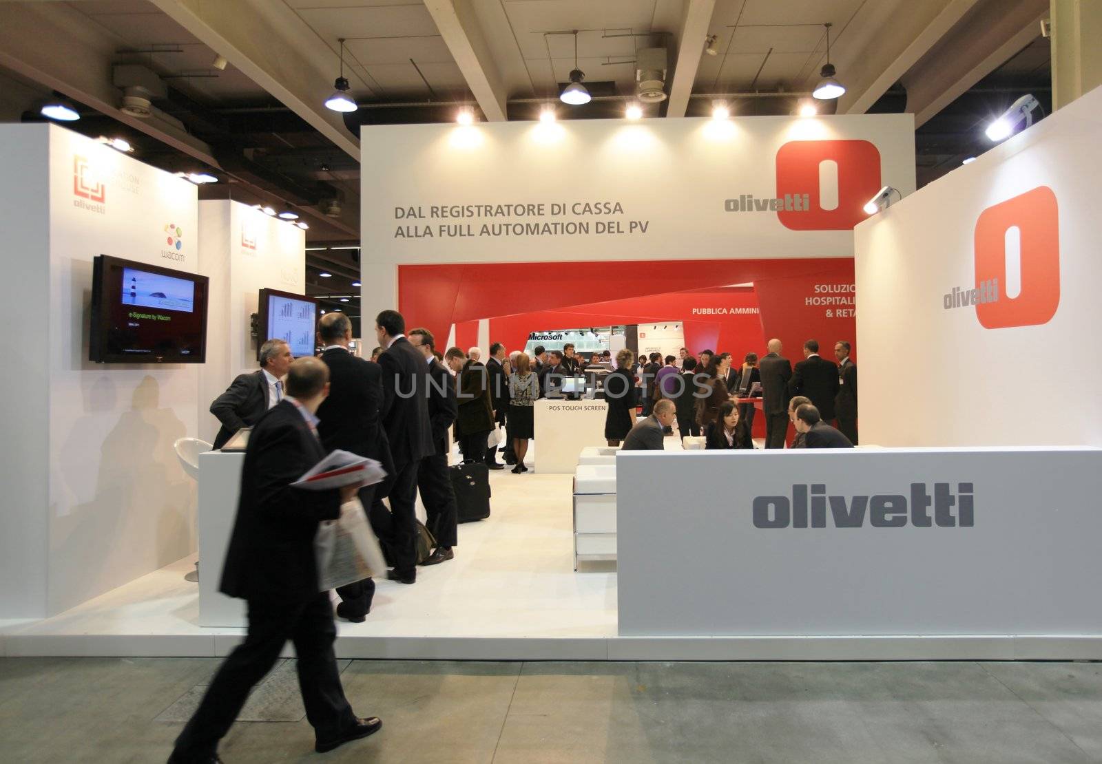 People visit Olivetti technologies stand during SMAU, international fair of business intelligence and information technology in Milan, Italy.