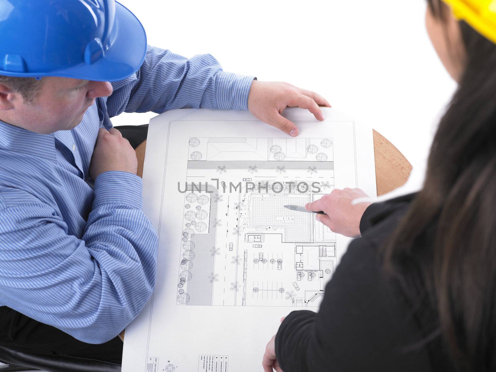 Two architects with helmet on meeting