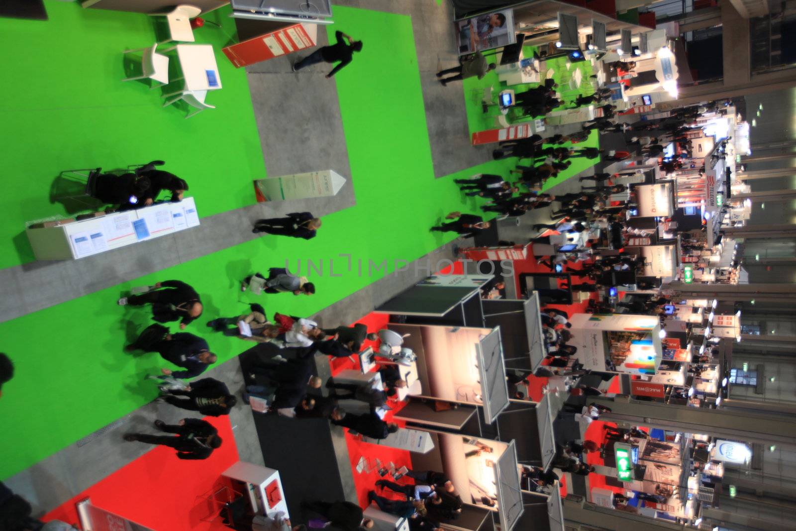 Panoramic view of people visiting technologies stands during SMAU, international fair of business intelligence and information technology in Milan, Italy.