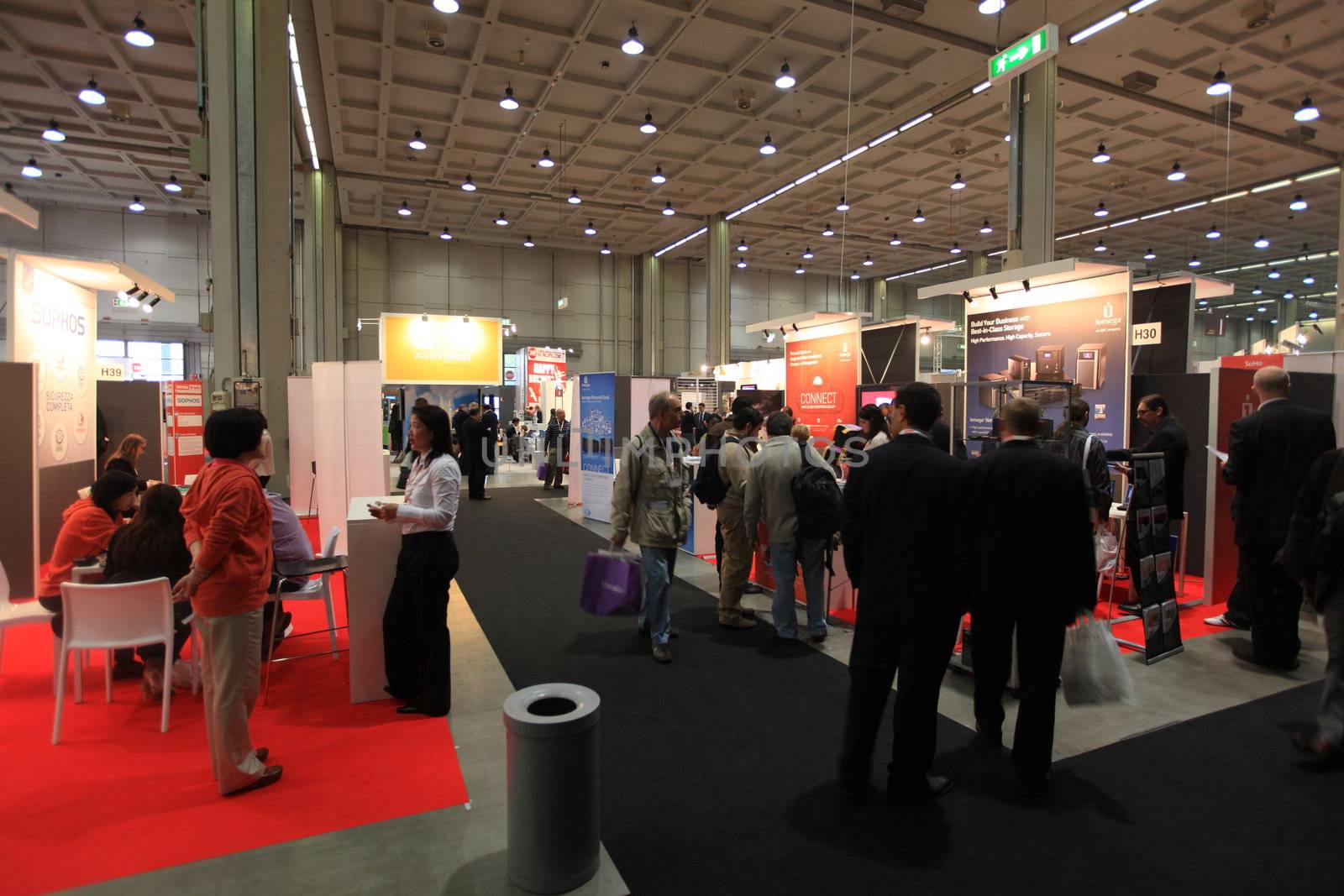 Panoramic view of people visiting technologies stands during SMAU, international fair of business intelligence and information technology in Milan, Italy.