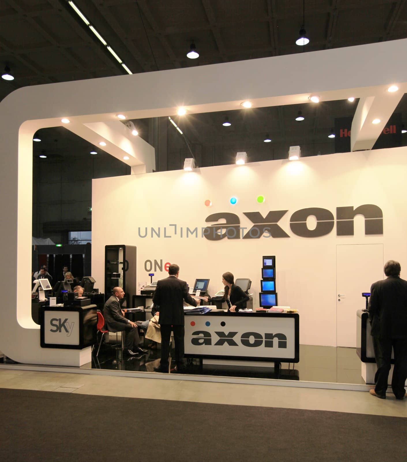 People visit Axon technologies stand during SMAU, international fair of business intelligence and information technology in Milan, Italy.