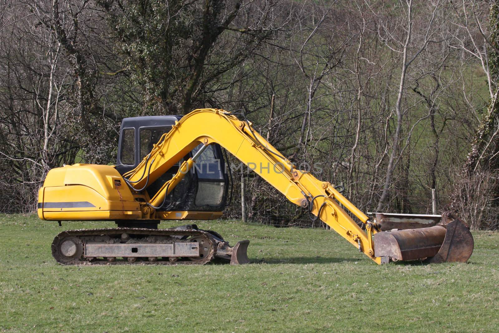 Digger excavator at work in a field