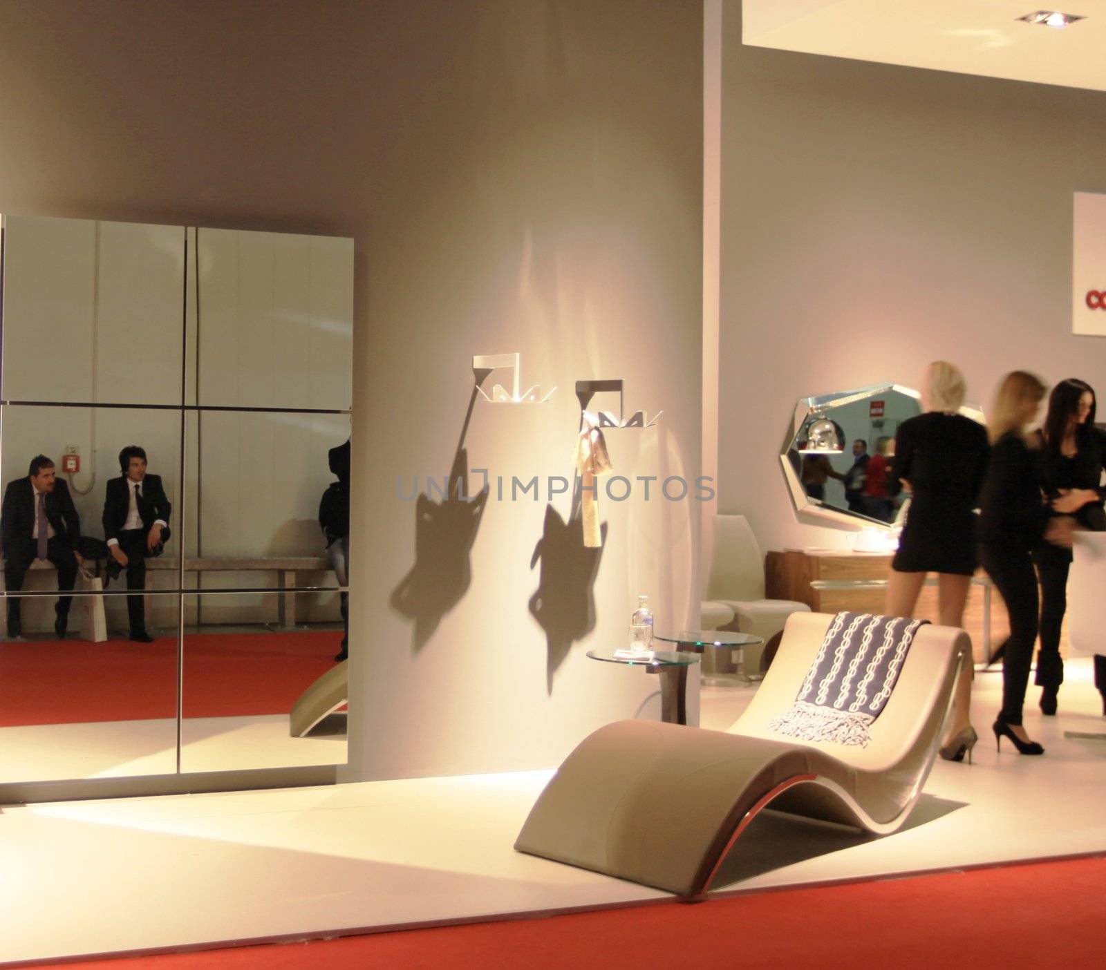 People visit interiors design stands and home architecture solutions at 2011 Salone del Mobile, international furnishing accessories exhibition in Milan, Italy.