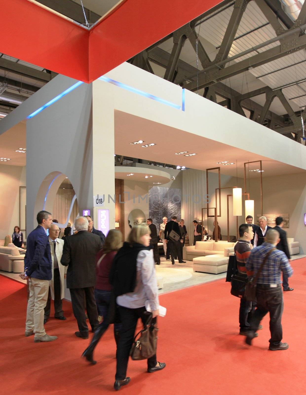 People visit interiors design stands and home architecture solutions at 2011 Salone del Mobile, international furnishing accessories exhibition in Milan, Italy.