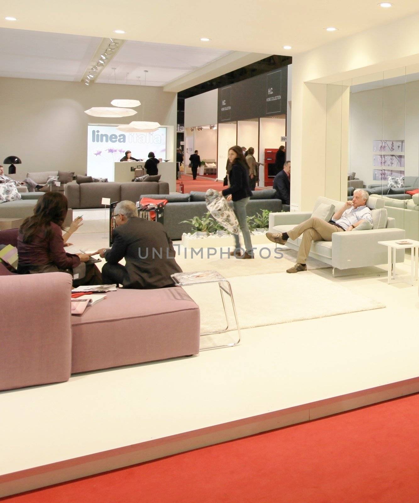 People visit interiors design stands and home architecture solutions at 2011 Salone del Mobile, international furnishing accessories exhibition in Milan, Italy.