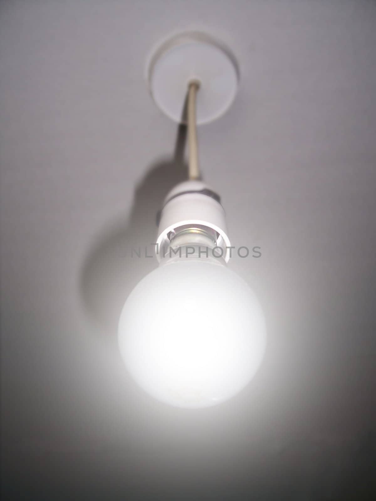 Hanging light-bulb, photo and illustration mix
