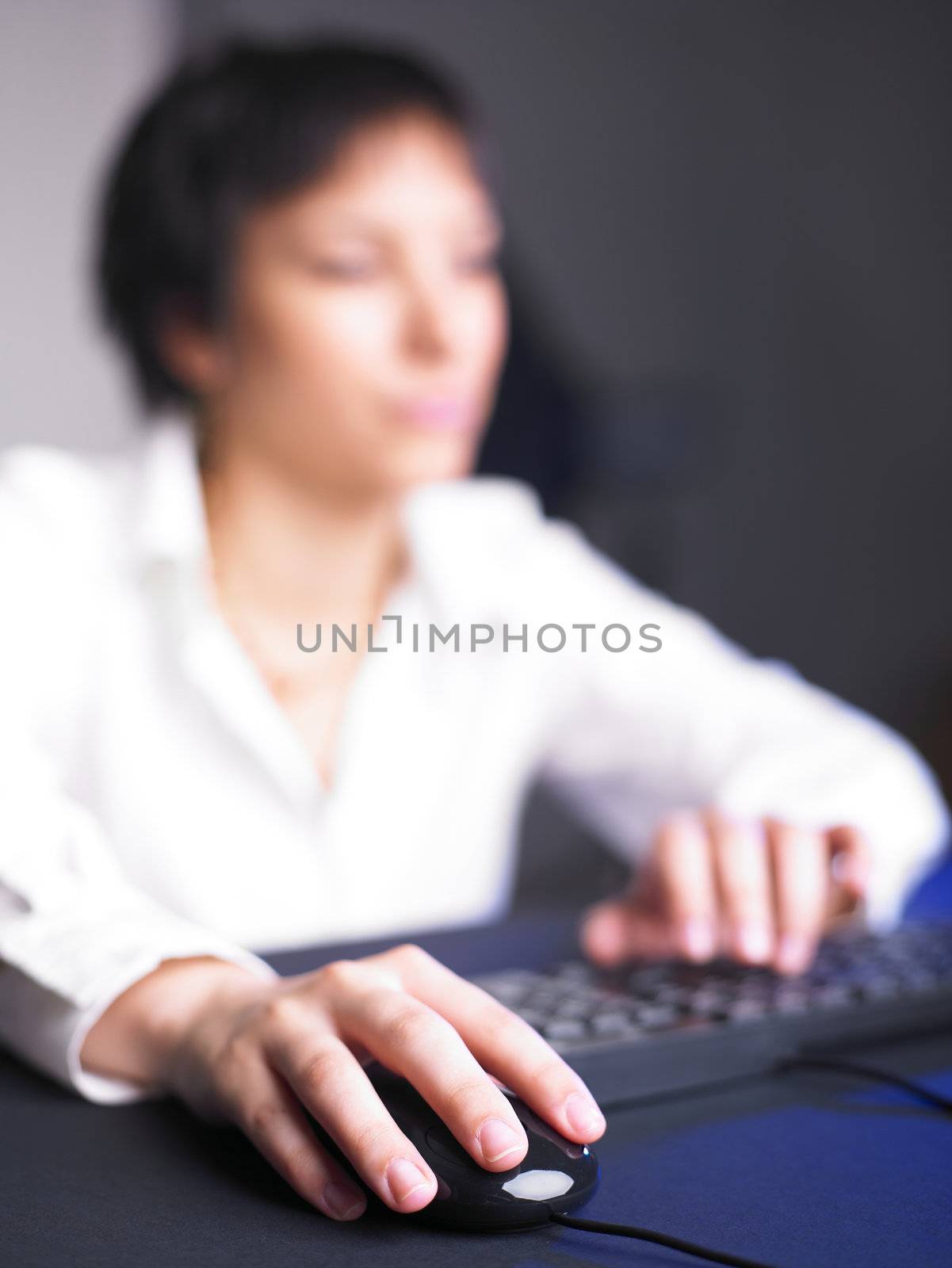 Business Woman Typing on Computer Keyboard by adamr
