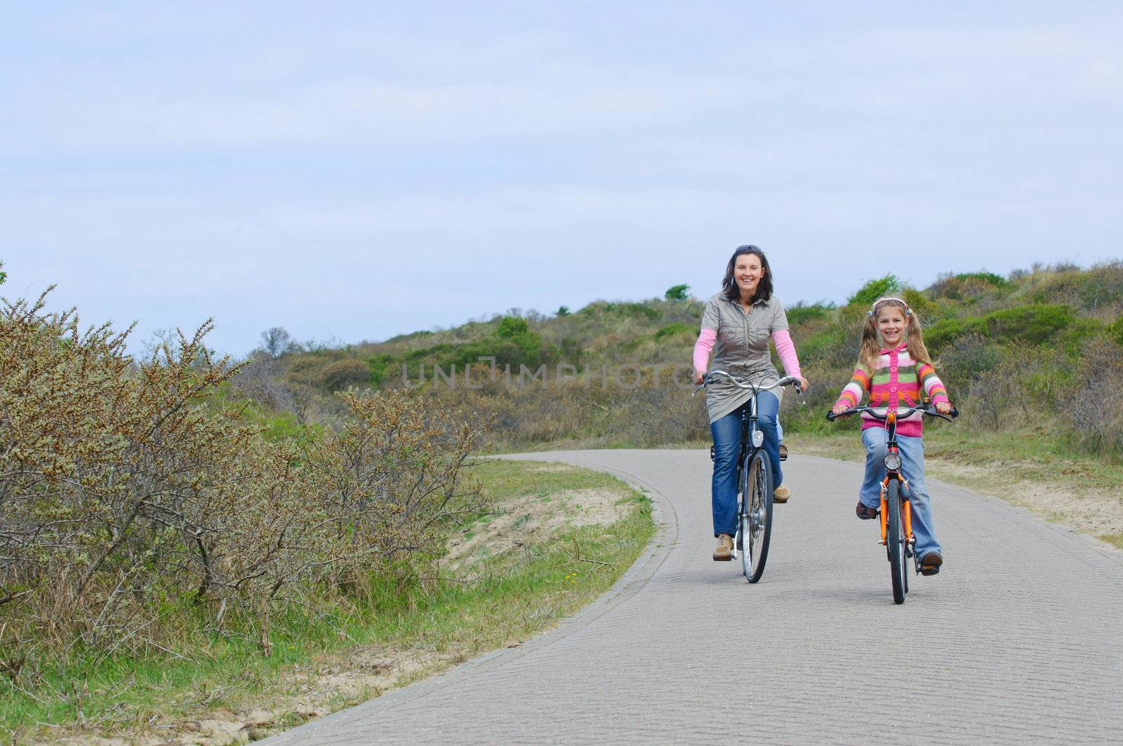 Mother with children having a weekend excursion on their bikes