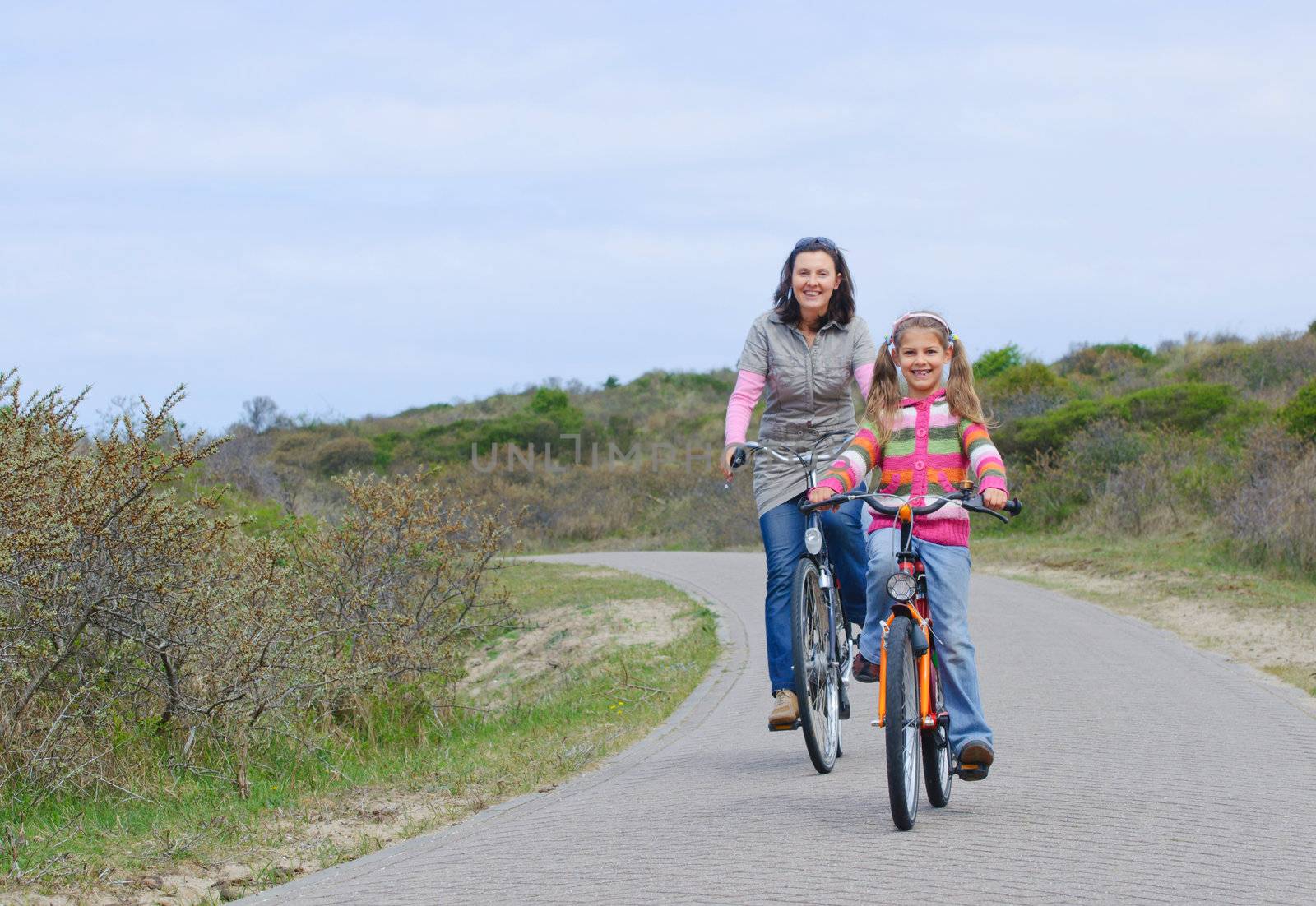 Mother with children having a weekend excursion on their bikes