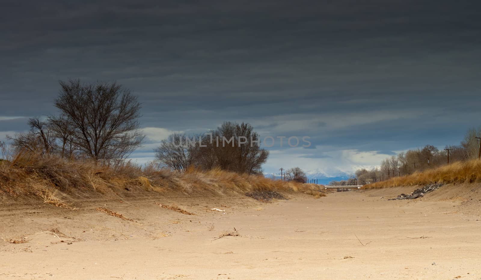 A beautiful photograph made using a neutral density filter.  The canal bed is dry and ready for water.