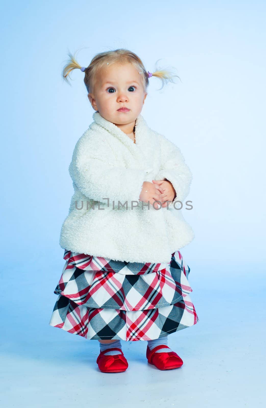 cute baby girl in black pink and white stylish outfit in studio