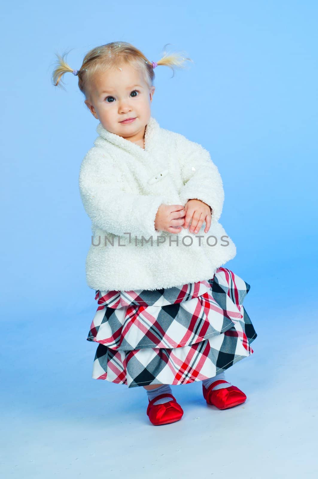 cute baby girl in black pink and white stylish outfit in studio