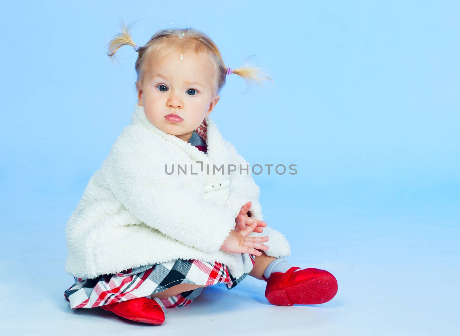 cute baby girl in black pink and white stylish outfit in studio