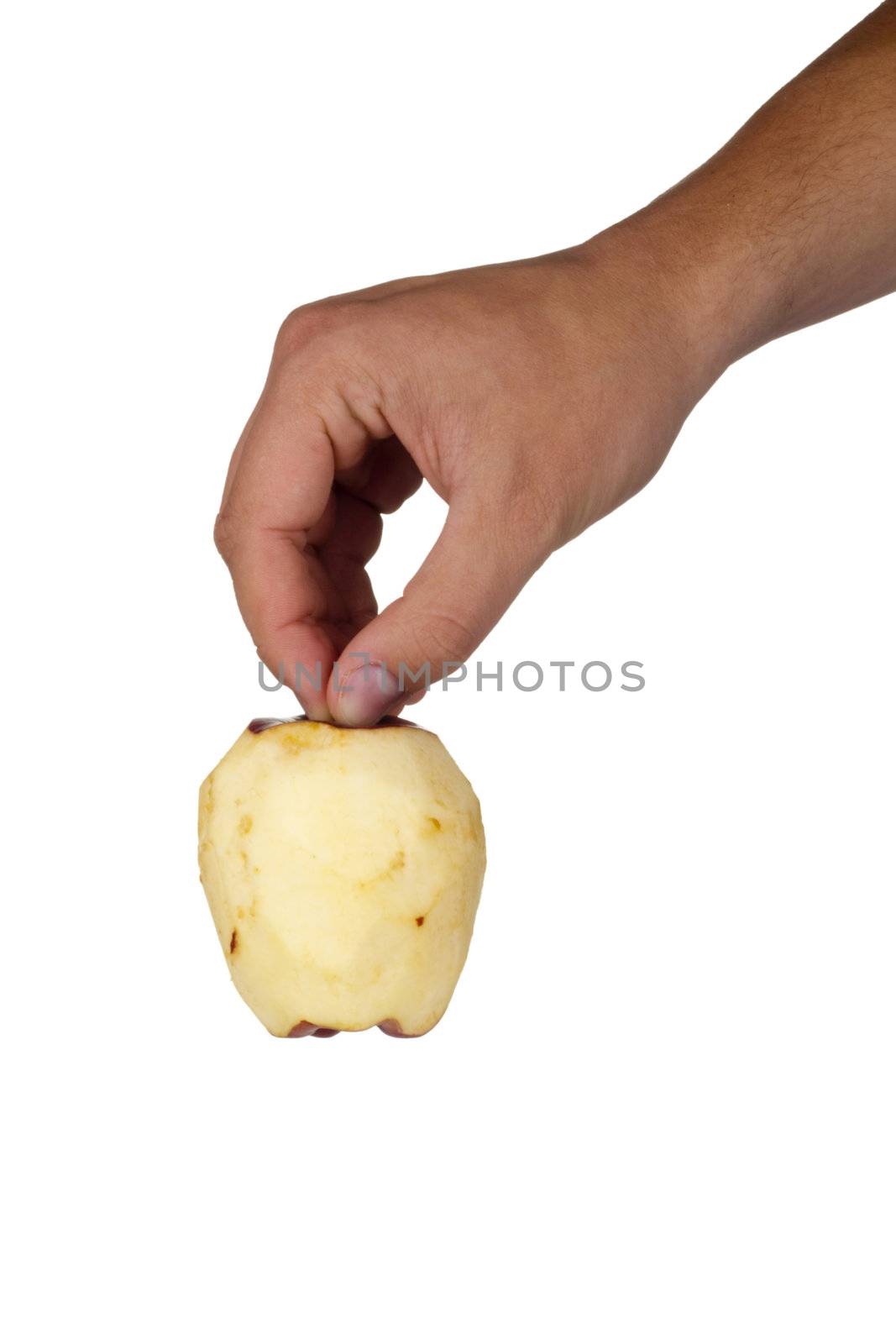 Peeled Braeburn apple in a hand isolated on a white background.