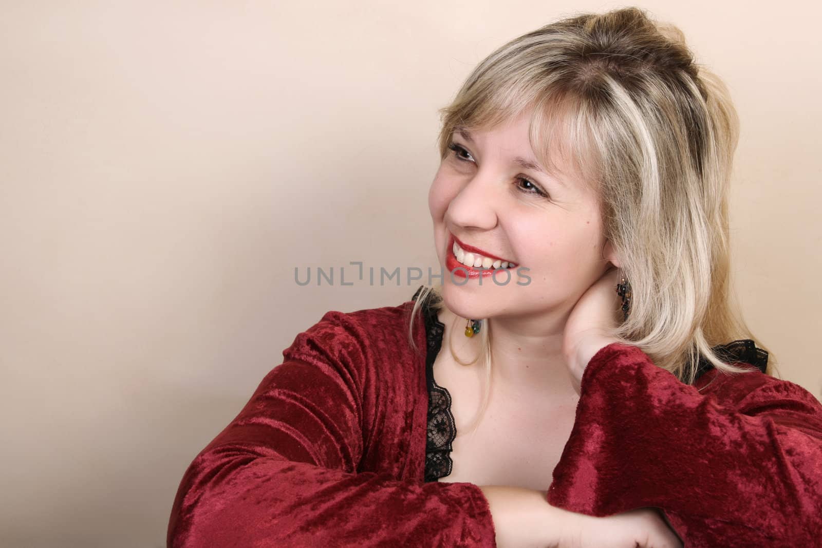 Beautiful blond female against a light background 