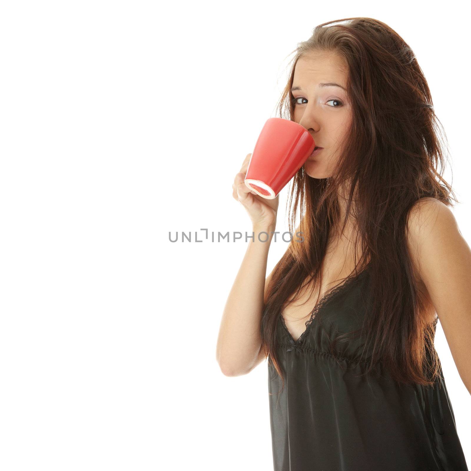 Morning woman in black lingerie with red mug isolated on white background