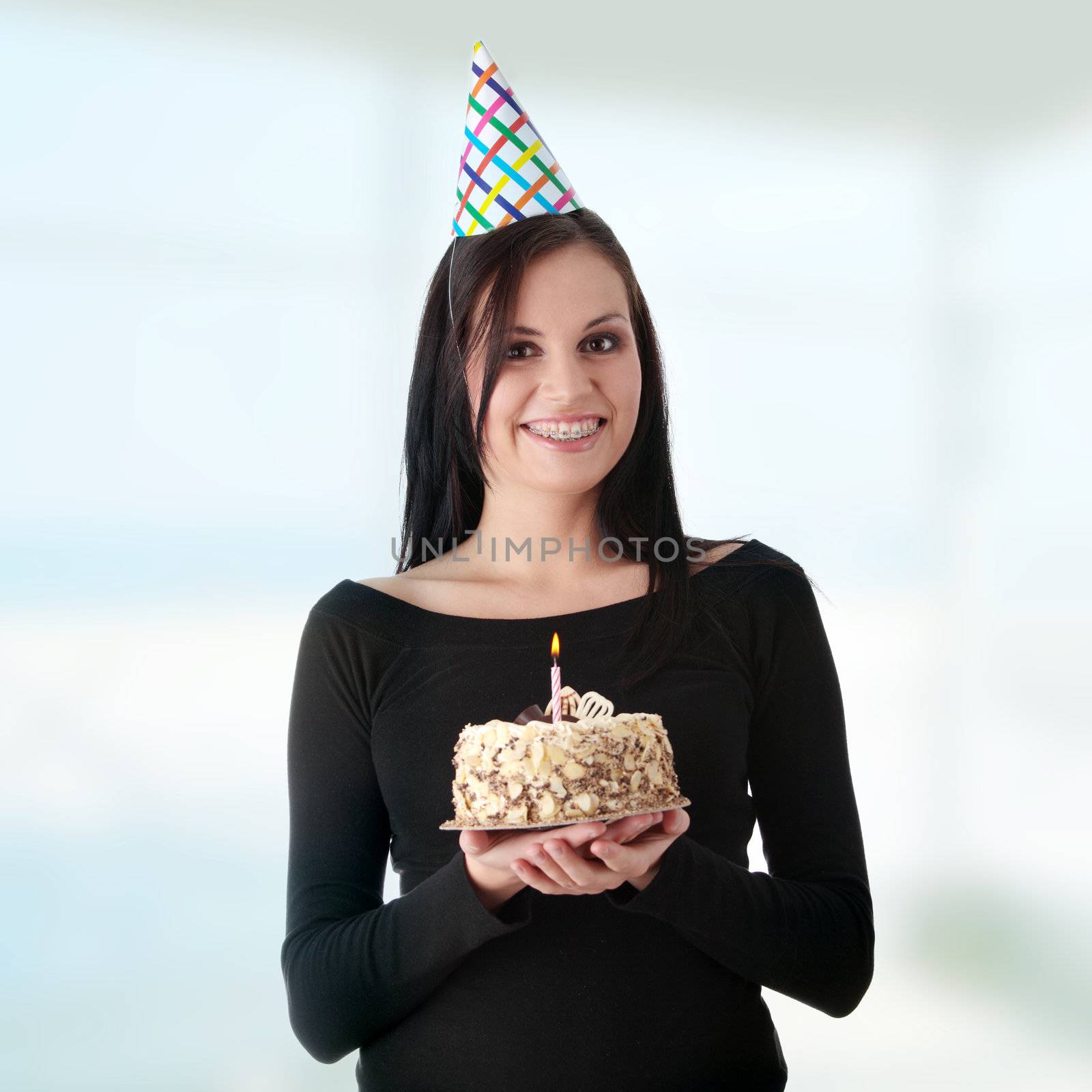 Beautiful young woman with birthday cake