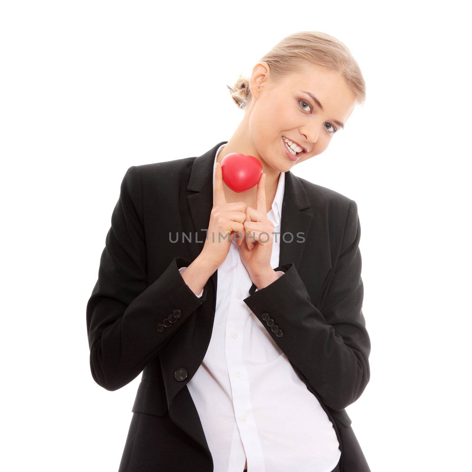 Young business woman holding heart shaped toy