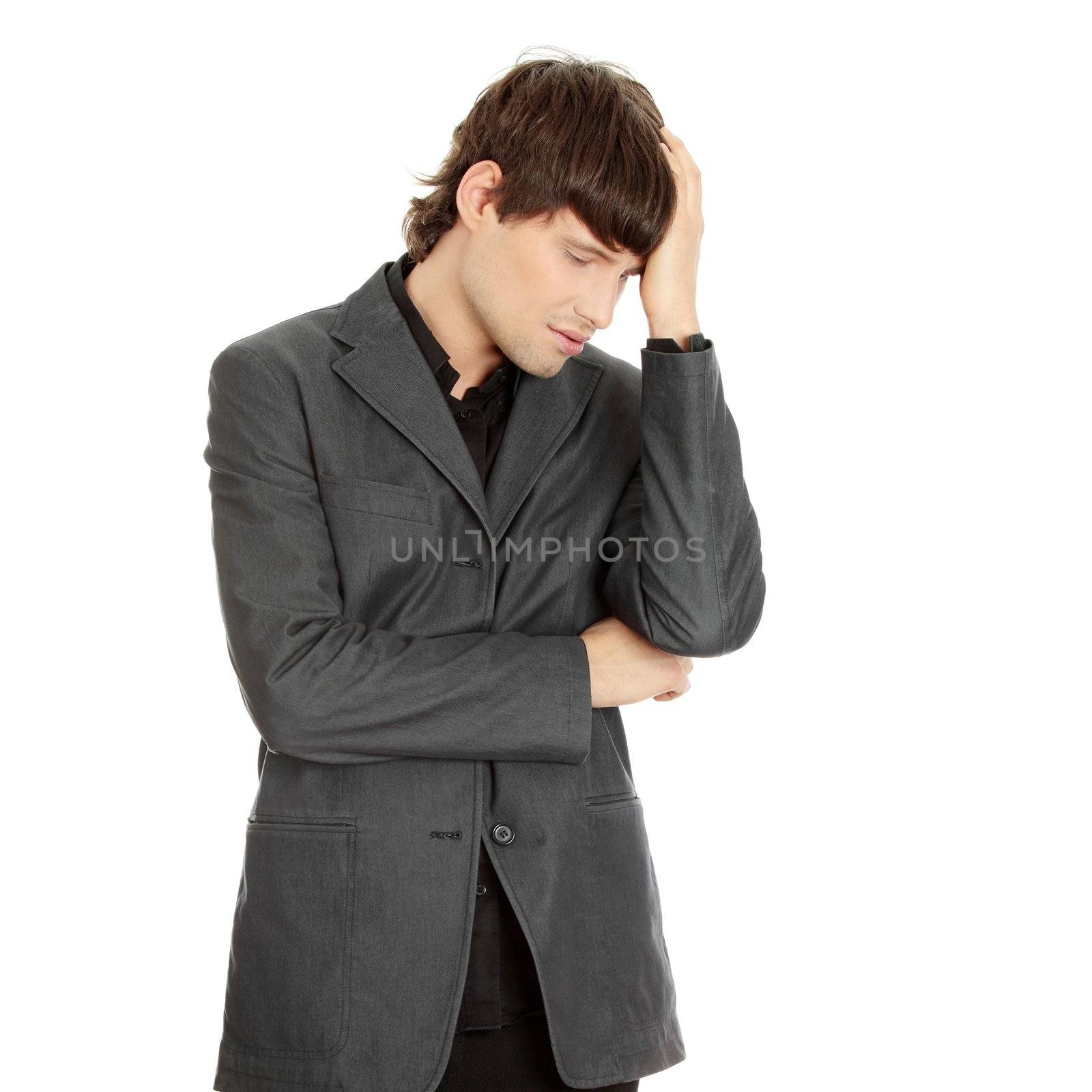 Young businessman with a big headache or problem, isolated on white