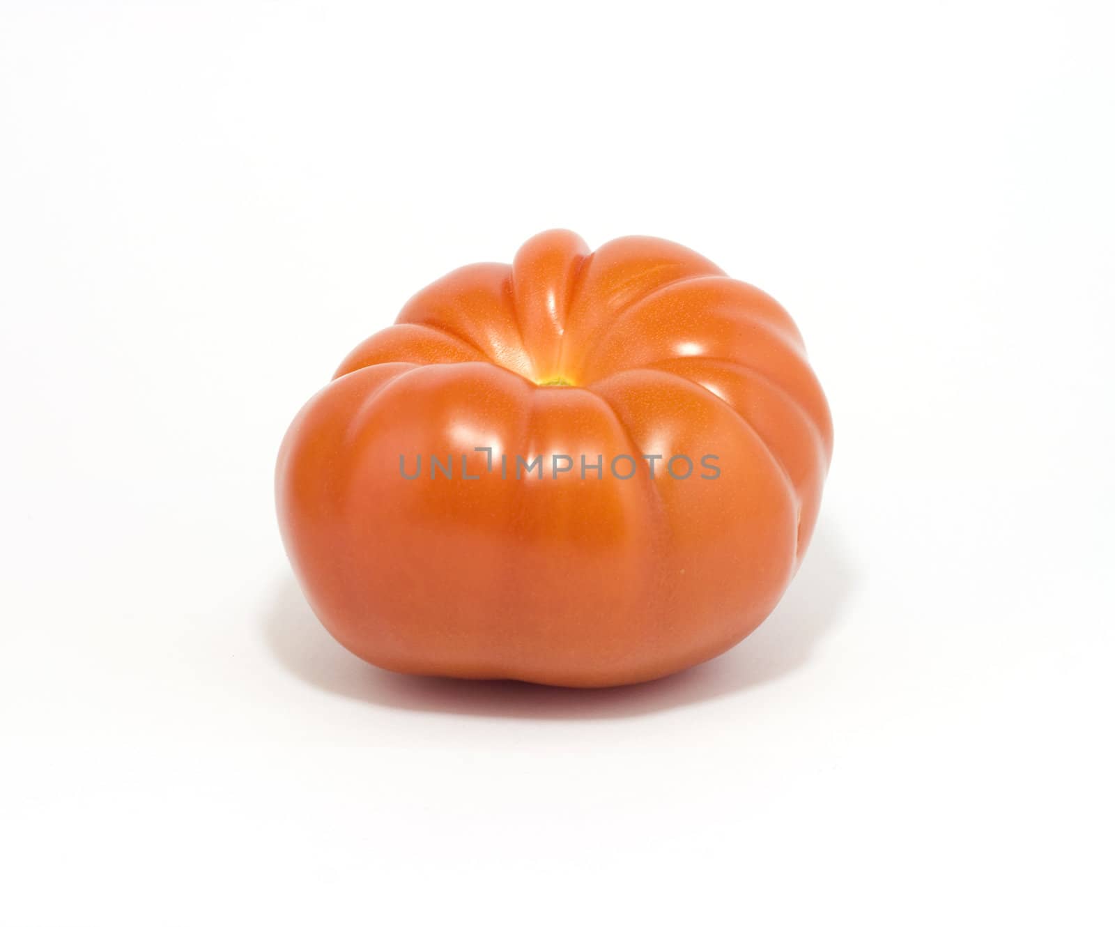 Big fresh tomato isolated on white