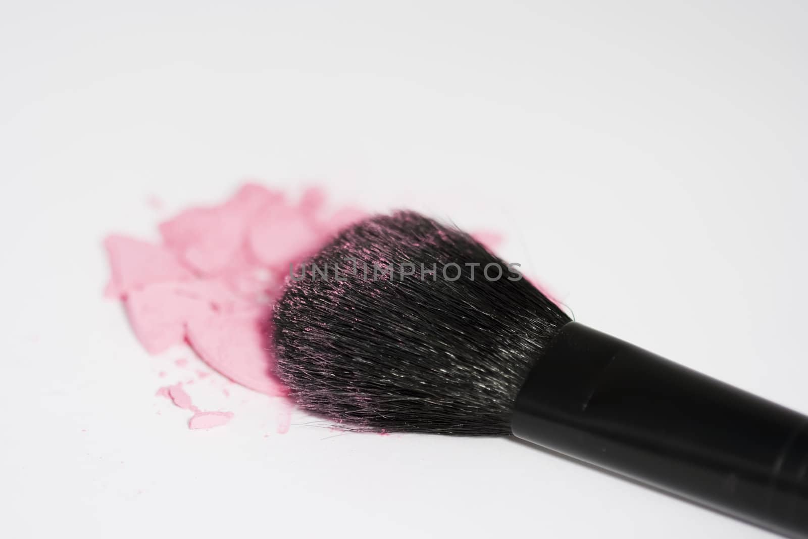 Blusher powder and applicator isolated on white background
