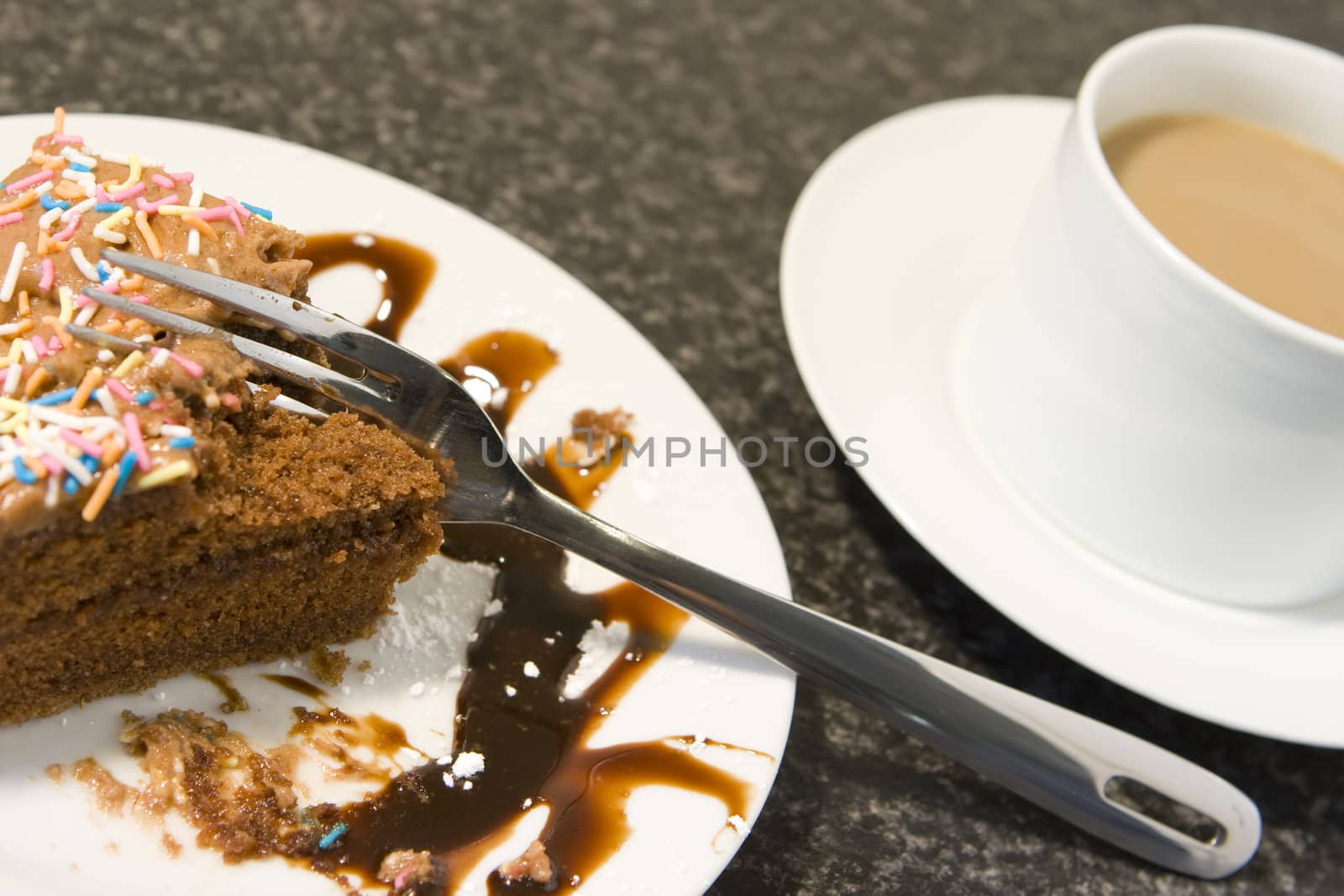 Coffee and cake on mottled grey background