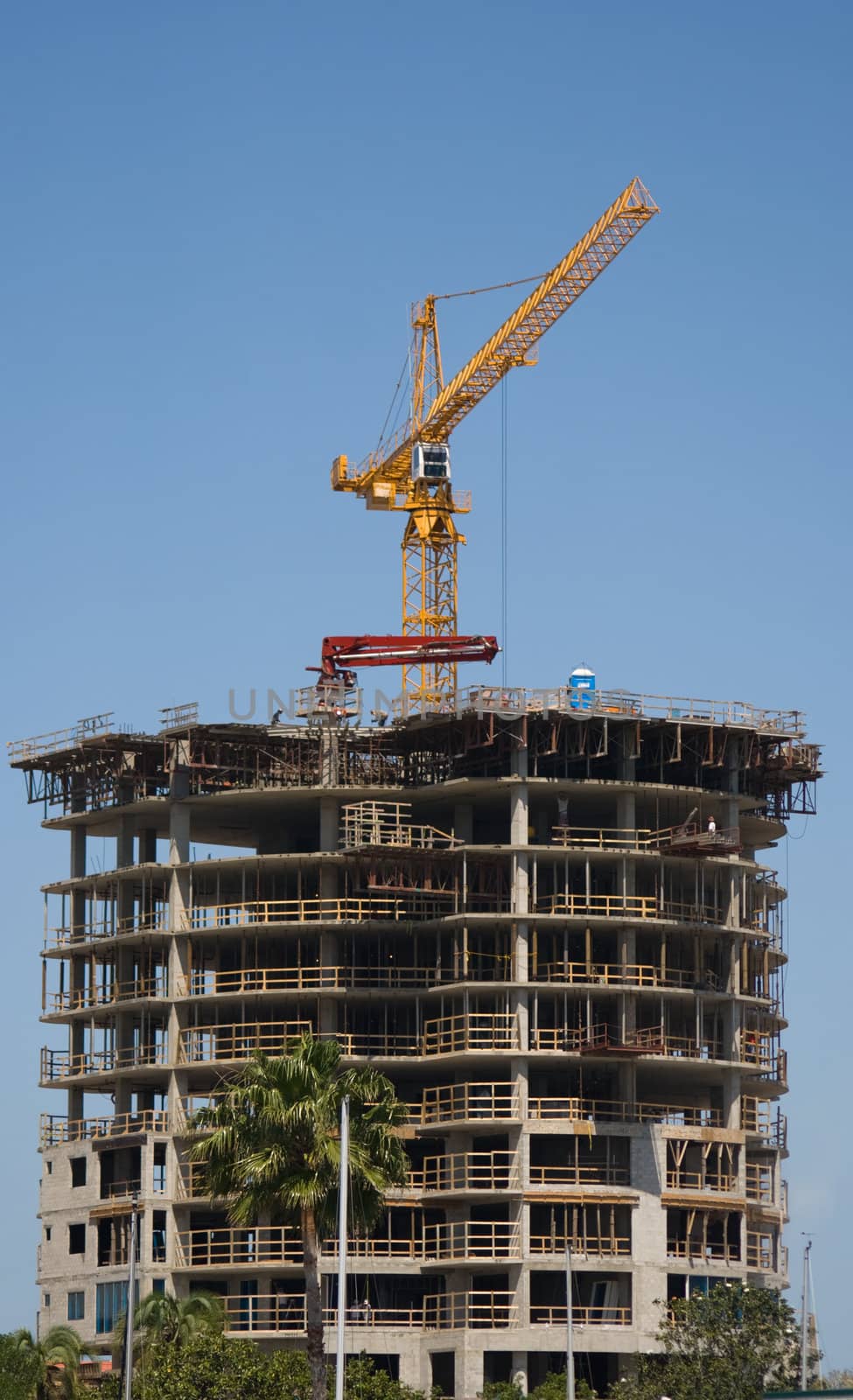 Business Building Contruction Crane is at the top of a new high rise project in St. Petersburg, Florida
