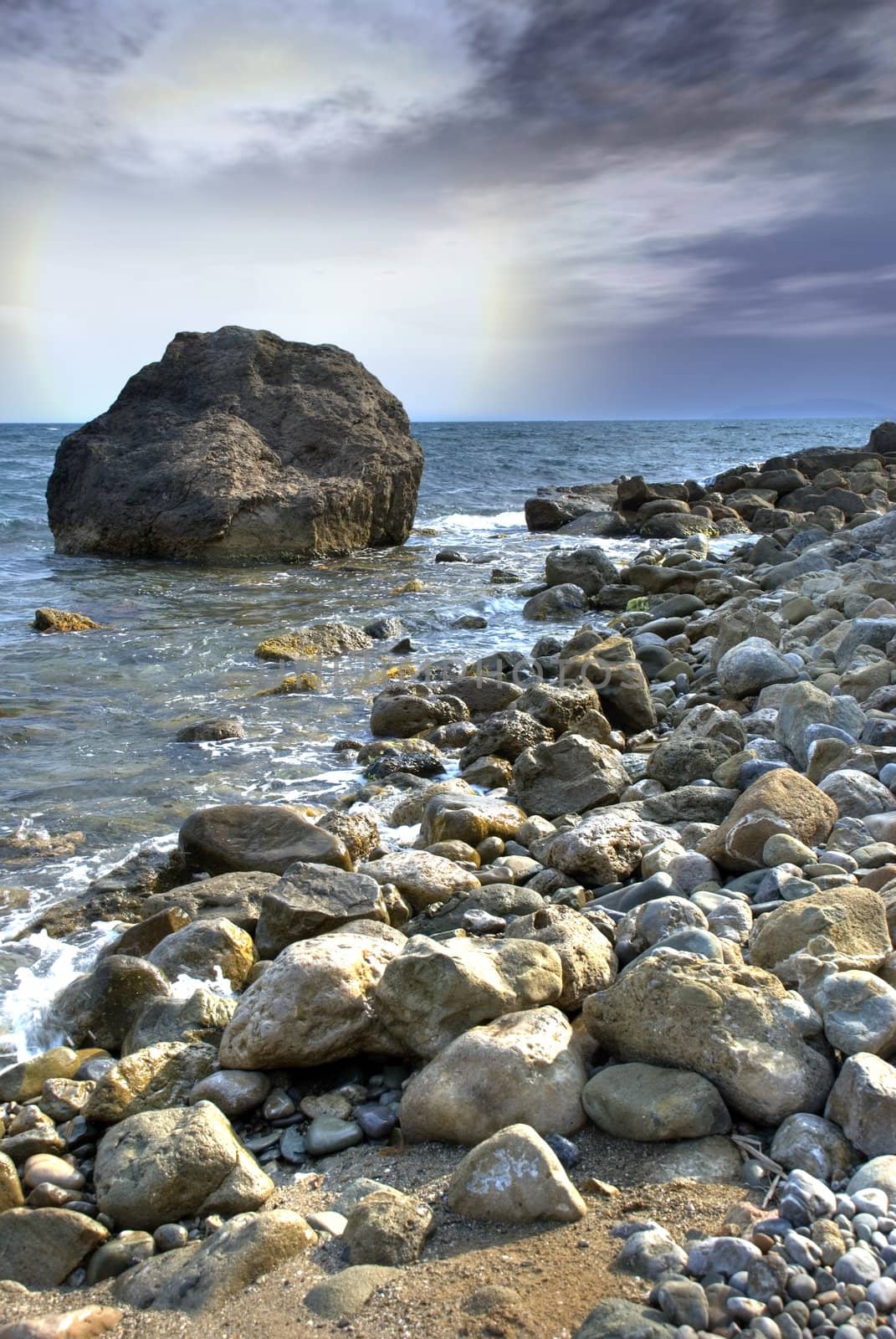 Fantastic decline on coast of ocean with impressive stones on forward the plan
