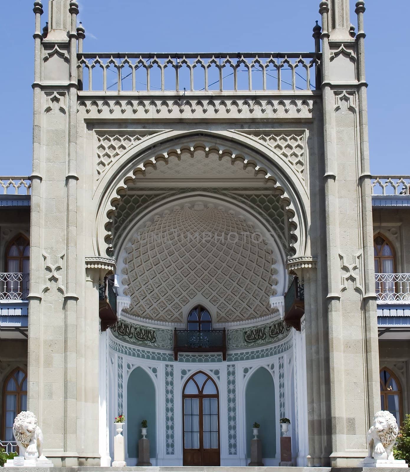 Facade of a palace with lions on an input and an ornament in the Italian style of XVI century 