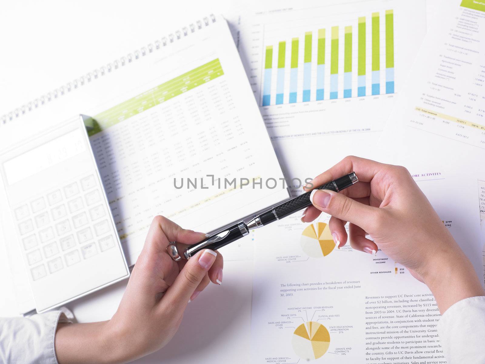 Analyzing Business Data - pen and numbers on paper