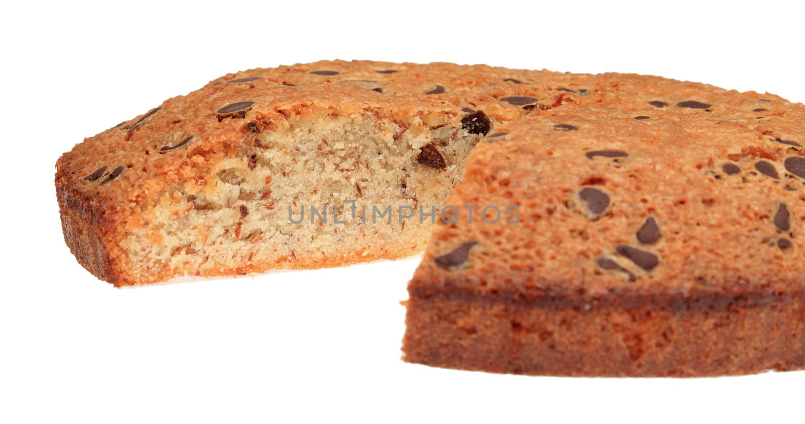 Close-up view of a French round cake with a piece missing, isolated against a white background