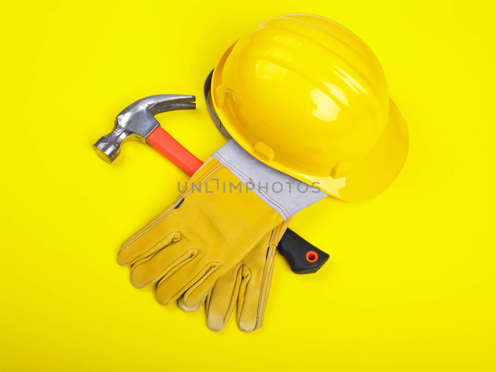 Worker equipment - HardHat Hammer And Gloves on yellow
