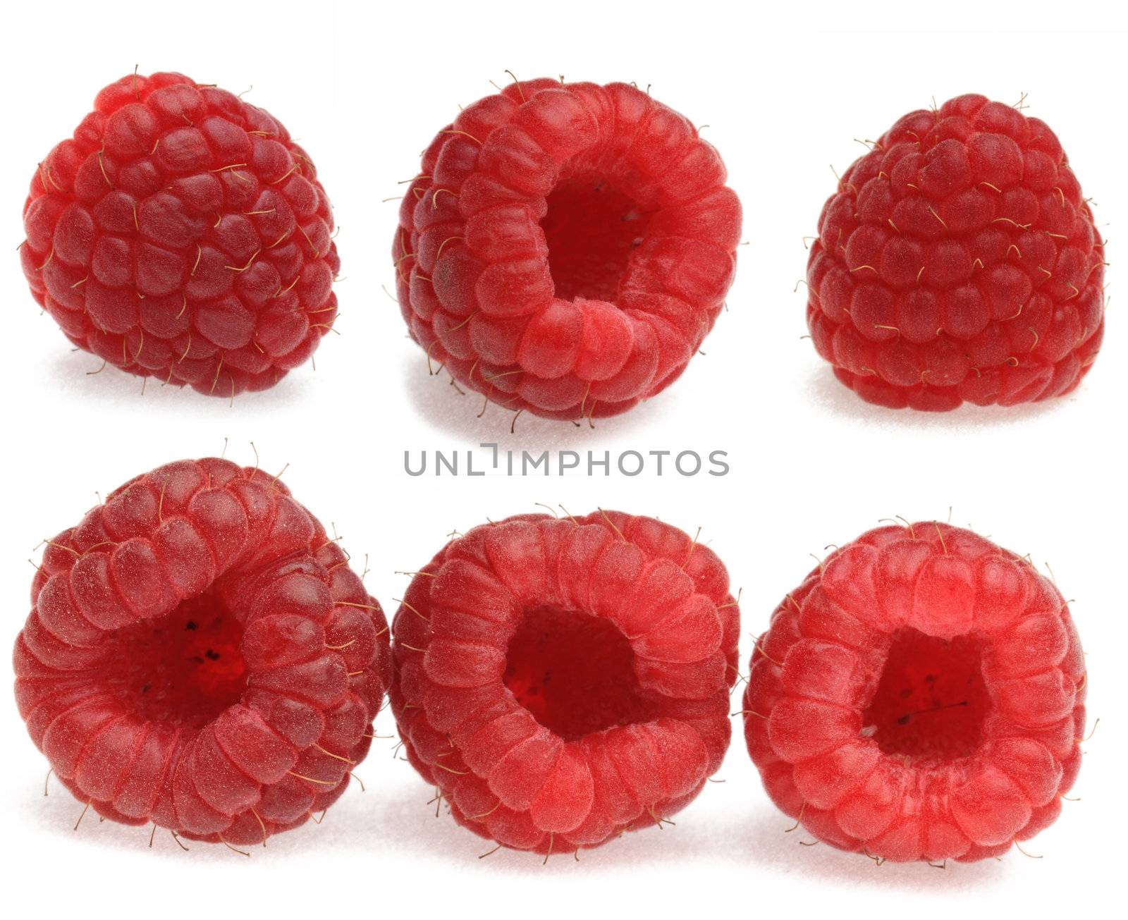 Collage of raspberries photographed in various positions in a studio against a white background with shadows.