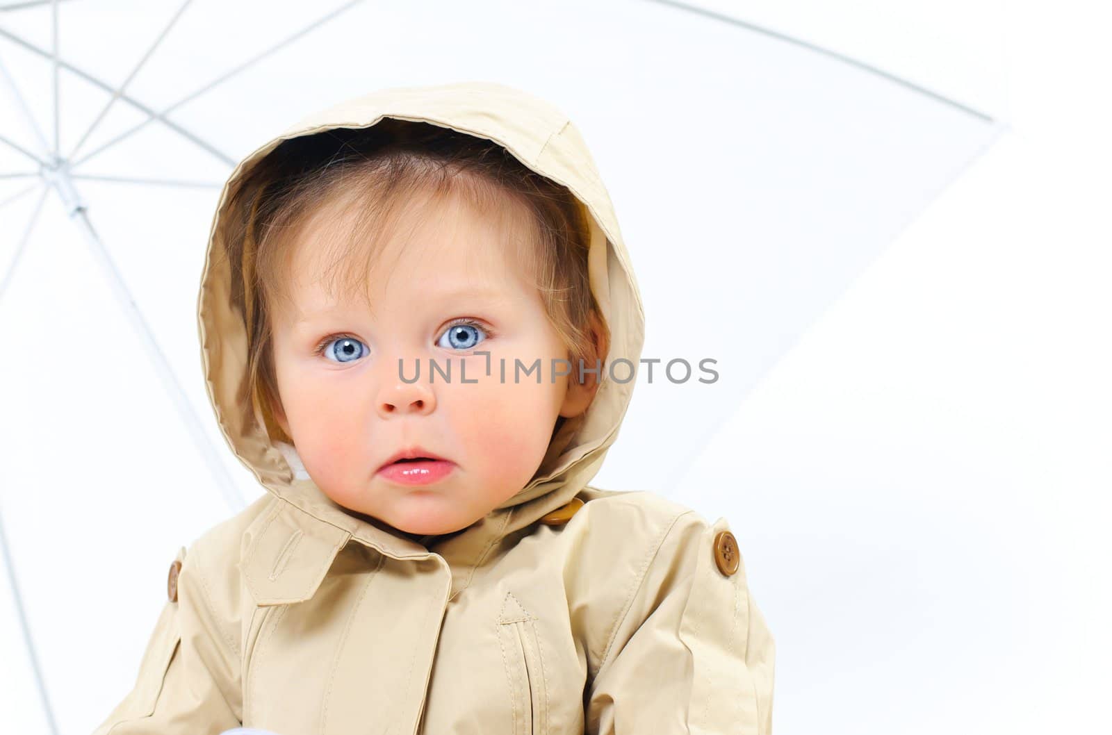 Very Cute Image of a Young baby Girl In hood in the studio