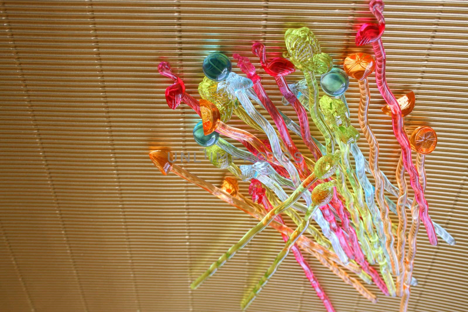 Cocktails sticks on a gold background at an angle