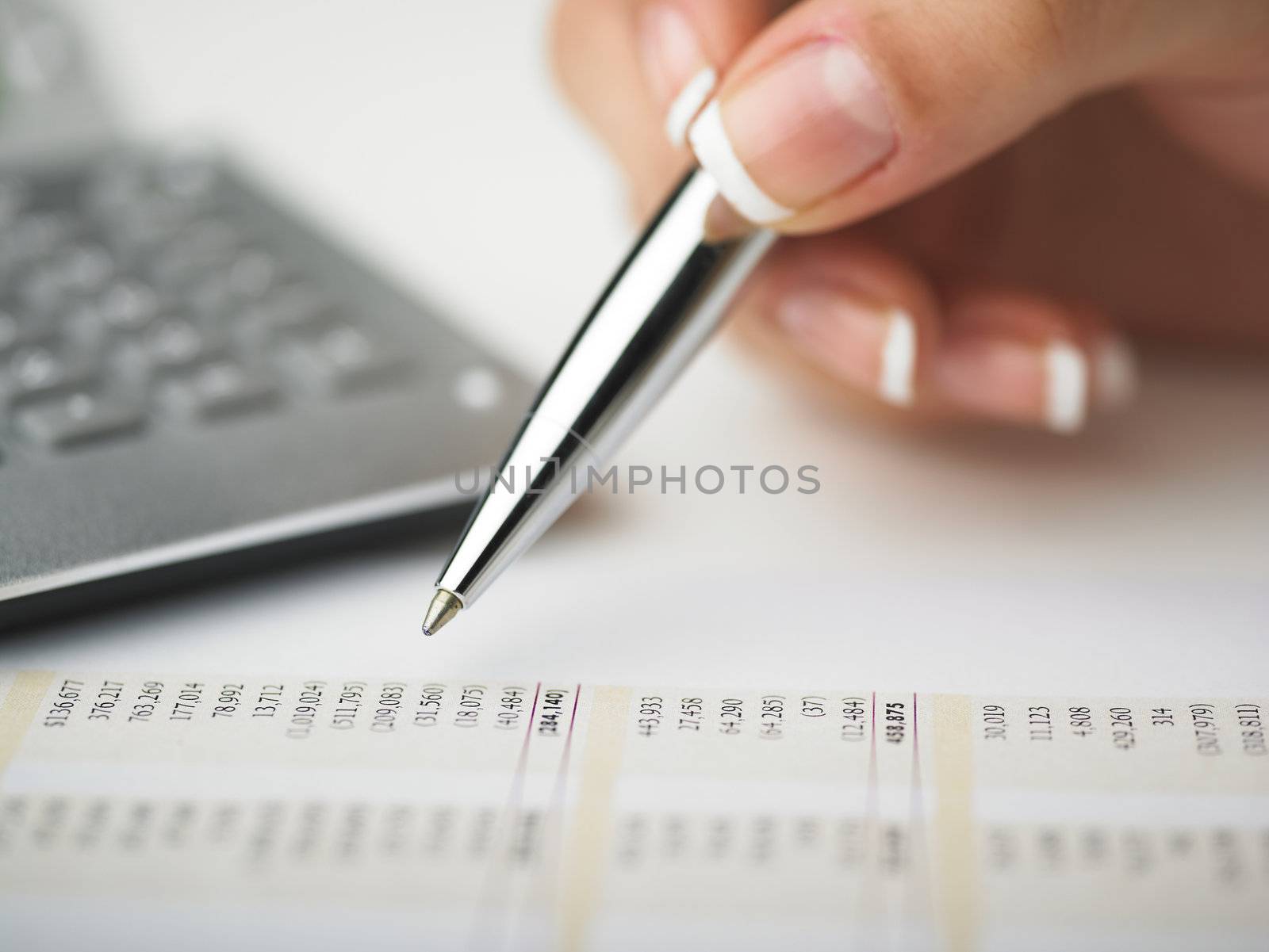 Market Analyze - pen and calculator on papers